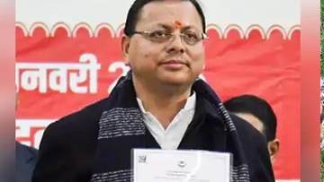 Pushkar Singh Dhami Showing UCC certificate